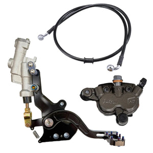 Talaria MX3/MX4 foot brake kit laid out, pedal with master cylinder, brake line and gray caliper
